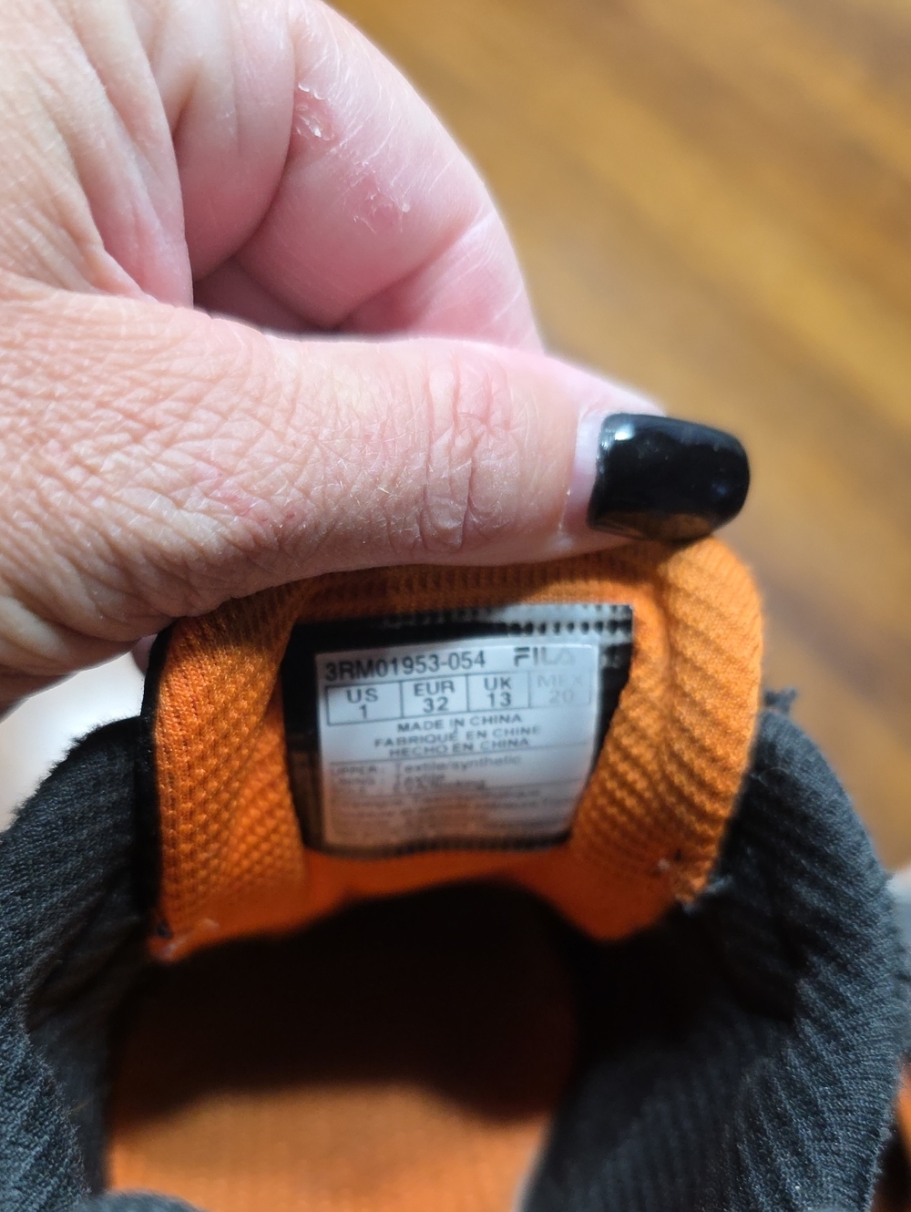 Fila Orange and Black Kids' Athletic Shoe Inner Tongue Detail
